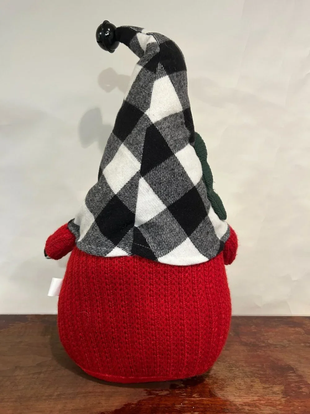 Christmas Holiday Gnome with bean bag base and bell on cap holding a tree